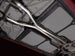 AWE Tuning 05-07 Chevrolet Corvette C6 6.0L X-Pipe, stainless steel exhaust component with polished finish, installed on vehicle.