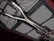AWE Tuning 05-07 Chevrolet Corvette C6 6.0L X-Pipe, stainless steel exhaust component with polished finish, installed on vehicle.