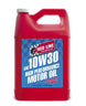 Red Line 10W30 motor oil gallon container with label and cap, suitable for automotive engine lubrication.