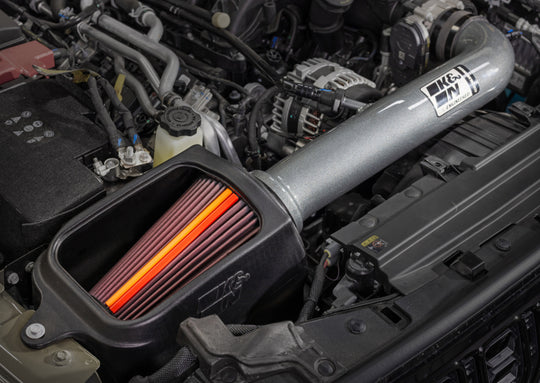 K&N Engineering aluminum cold air intake for 2018-2026 Jeep Wrangler and Gladiator NextGen models, showing the intake system and filter.