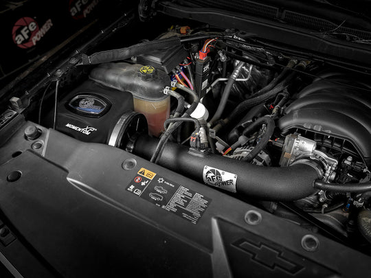 aFe POWER Momentum XP Pro 5R cold air intake system installed in 2014-2018 GM trucks and SUVs with V8 5.3L engine, showing the intake tubing.