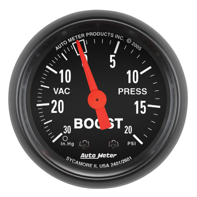 AutoMeter Z Series 52mm mechanical boost and vacuum gauge displaying 20 PSI with black face and silver bezel.