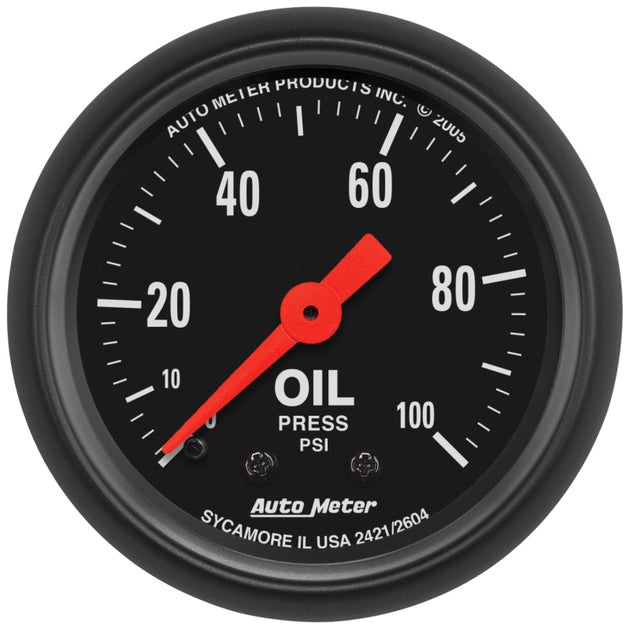 AutoMeter Z Series 52mm mechanical oil pressure gauge with 0-100 PSI dial and black face for automotive monitoring.