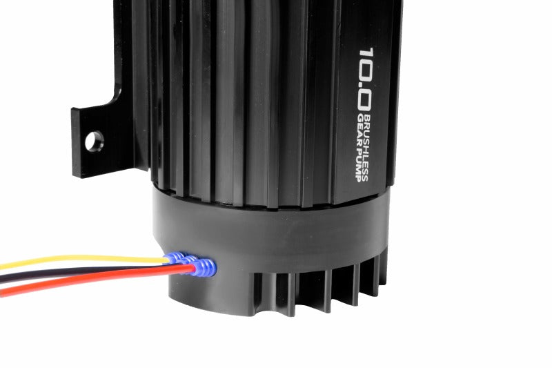 Aeromotive TVS In-Line Brushless Spur 10.0 external fuel pump showing metal body and inlet/outlet ports for high-performance fuel delivery.