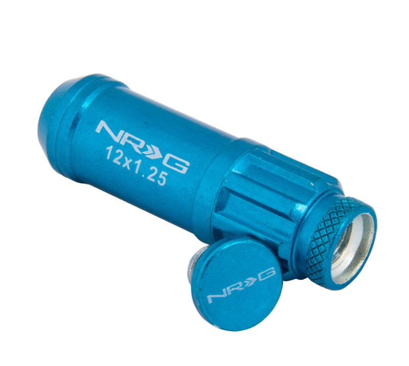NRG 700 Series M12 x 1.25 steel lug nut set with dust cap covers, locks, and lock socket in blue, displayed on a wheel.