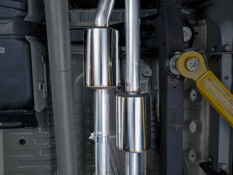 AWE Tuning 4th Gen GM 1500 6.2L catback exhaust with quad chrome tips and split rear exit with bumper cutouts.