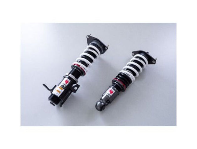 HKS Hipermax R ZN8 coilover kit installed on a vehicle, showcasing adjustable suspension components and branding details.