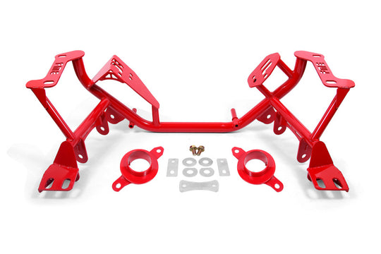 Red BMR Ford Mustang K-Member crossmember with spring perches for 1979-1995 models, featuring sturdy construction and mounting points.