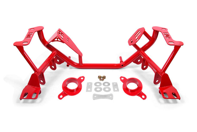 Red BMR Ford Mustang K-Member crossmember with spring perches for 1979-1995 models, featuring sturdy construction and mounting points.