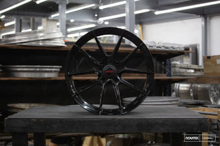 Vossen forged NF10 21x9.5 inch gloss black front wheel for Ferrari 296 with 5x114.3 bolt pattern and ET38 offset.