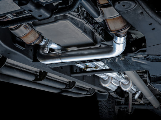 AWE Tuning 4th Gen GM 1500 6.2L catback exhaust with quad chrome tips and split rear exit with bumper cutouts.