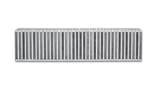 Vibrant vertical flow intercooler measuring 27 inches wide, 6 inches high, with a 4.5-inch thickness, featuring cooling fins and inlet/outlet ports.