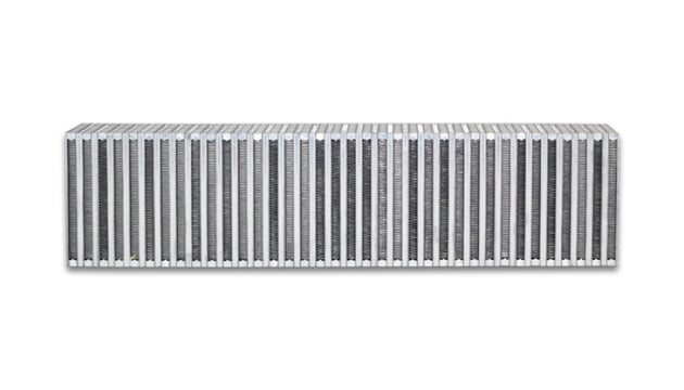 Vibrant vertical flow intercooler measuring 27 inches wide, 6 inches high, with a 4.5-inch thickness, featuring cooling fins and inlet/outlet ports.