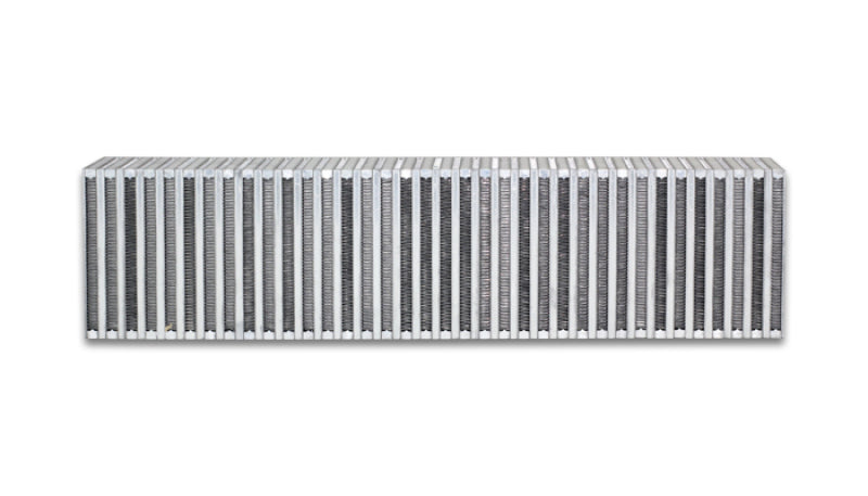 Vibrant vertical flow intercooler measuring 27 inches wide, 6 inches high, with a 4.5-inch thickness, featuring cooling fins and inlet/outlet ports.