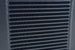 CSF universal large single-pass oil cooler with M22x1.5 fittings, measuring 12in long, 9.33in high, and 2.16in wide, for automotive cooling