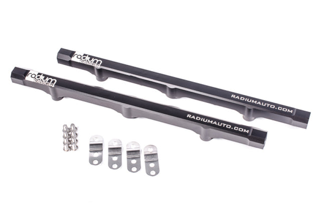 Radium Engineering GM LS7 engine fuel rails in black with metal fittings, designed for high-performance fuel delivery.