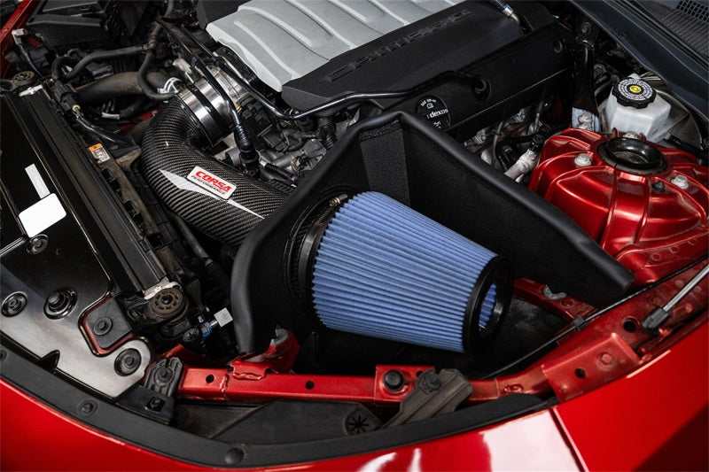 Corvette Camaro SS 6.2L V8 carbon fiber open element cold air intake by CORSA Performance with oiled filter in close-up view.