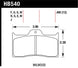 Hawk Performance Wilwood DTC-60 racing brake pads with black friction material and metal backing plates, designed for high-performance braking.