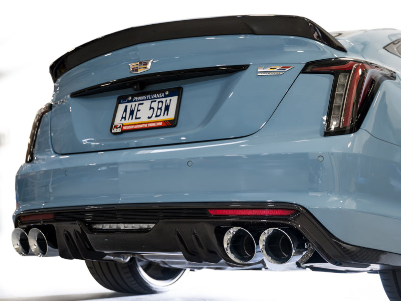 AWE Tuning Cadillac CT5-V Blackwing catback exhaust with chrome silver tips, showcasing sleek black muffler and dual exhaust outlets.