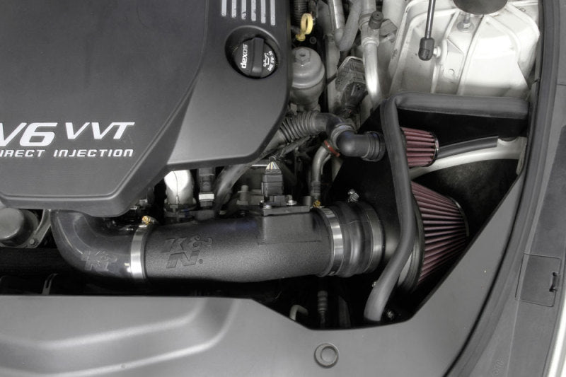 K&N Engineering cold air intake for 2013-2015 Cadillac ATS V6 3.6L engine, showing the AirCharger performance intake system.