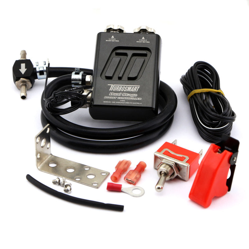 Turbosmart Dual Stage Boost Controller V2 in black, showing the compact device with control knobs and branding for car turbo boost management.