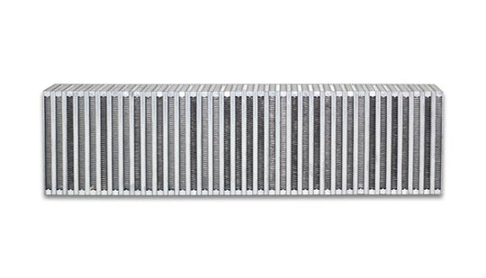 Vibrant vertical flow intercooler core, 24-inch wide, 6-inch high, 3.5-inch thick, with fins and mounting points for automotive cooling