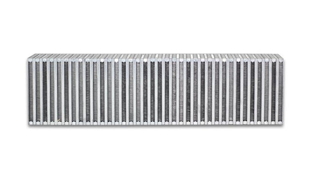 Vibrant vertical flow intercooler core, 24-inch wide, 6-inch high, 3.5-inch thick, with fins and mounting points for automotive cooling
