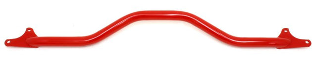 Red BMR Suspension GTO front strut tower brace installed in a vehicle, enhancing chassis rigidity and handling.