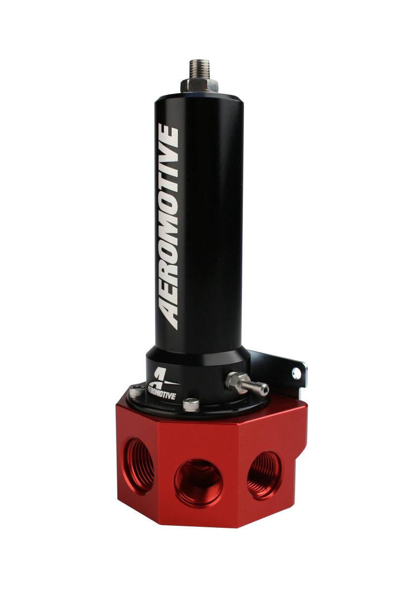 Aeromotive belt drive fuel pressure regulator for EFI systems, mounted on a vehicle engine with hoses connected for fuel regulation.