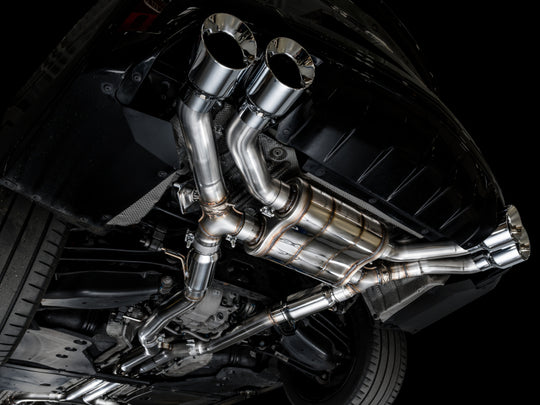 AWE Tuning catback SwitchPath exhaust for 2021+ Cadillac CT4-V Blackwing with chrome silver tips, shown installed on the vehicle.