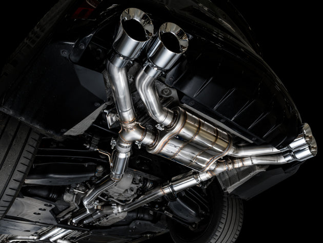 AWE Tuning catback SwitchPath exhaust for 2021+ Cadillac CT4-V Blackwing with chrome silver tips, shown installed on the vehicle.