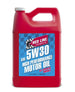Red Line 5W30 motor oil gallon container with label, suitable for engine lubrication and vehicle maintenance.
