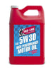 Red Line 5W30 motor oil gallon container with label, suitable for engine lubrication and vehicle maintenance.
