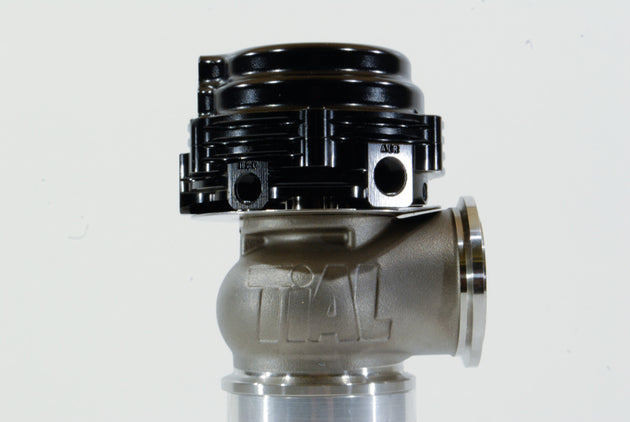 Black TiAL Sport MVS Wastegate with all springs and clamps, showcasing the compact, high-performance automotive turbocharger component.