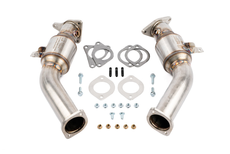 AMS Performance VR30DDTT street lower downpipes with GESI catalytic converter installed, showcasing the sleek, polished metal pipes.