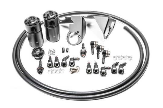 Radium Engineering 05-13 Chevrolet Corvette oil catch cans with dual catch can kit, installed in engine bay for fluid management