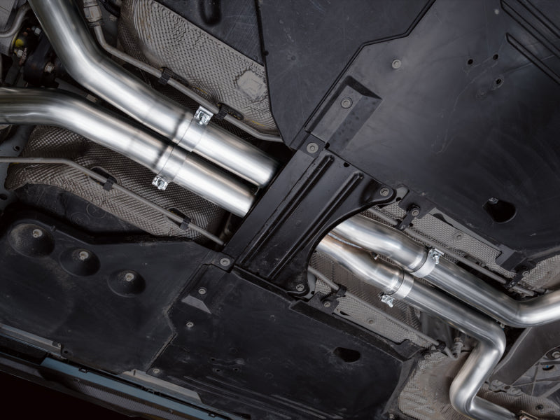 AWE Tuning catback SwitchPath exhaust for Cadillac CT5-V Blackwing with chrome silver tips, showcasing polished exhaust tips and piping.
