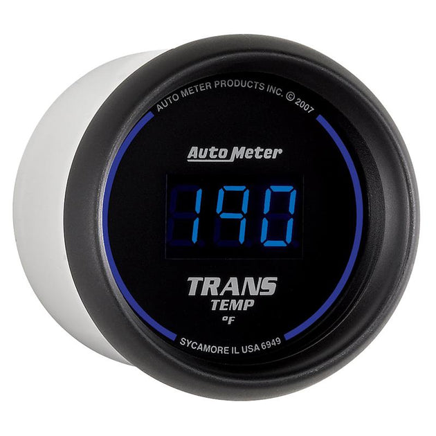 AutoMeter 52.4mm black digital transmission temperature gauge showing a digital display and sleek black dial with mounting hardware.