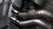 Stainless Works 3-inch dual turbo cat-back exhaust system with mufflers for CTSV, displayed on a vehicle.