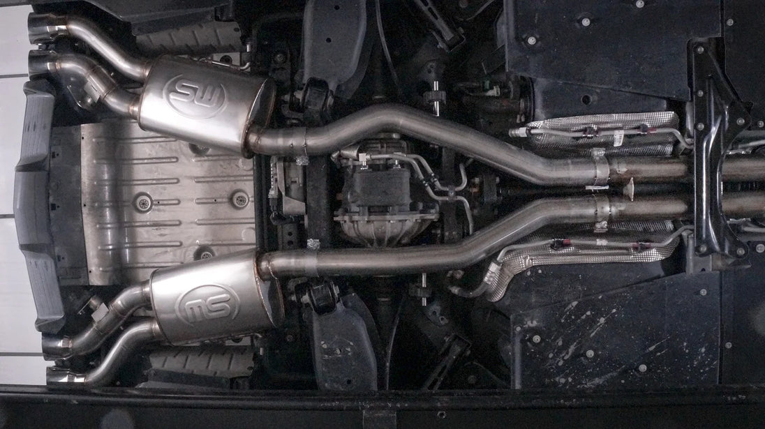 Stainless Works 3-inch dual turbo cat-back exhaust system with mufflers for CTSV, showcasing polished stainless steel pipes and mufflers.