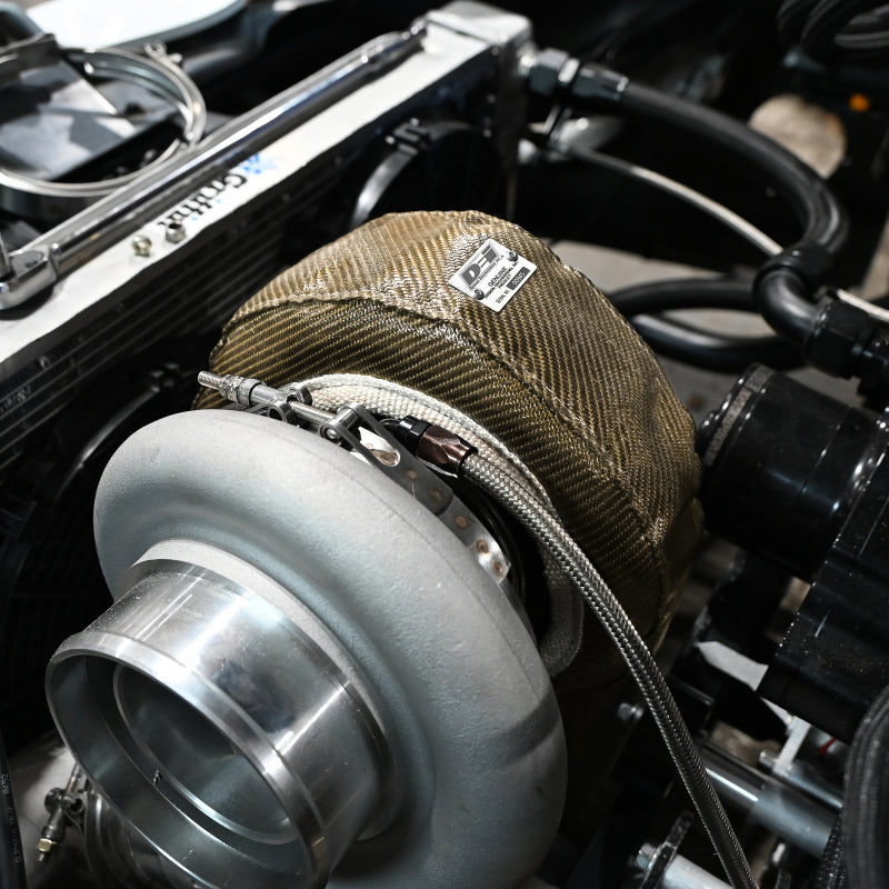 Titanium DEI Gen-3 Turbo Shield T3 turbo blanket shield designed to protect and insulate turbochargers in automotive applications.