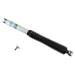 Bilstein 5125 Series off-road 9-inch lift truck shock absorber with 46mm monotube design, showing the shock in a rugged outdoor setting.