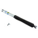 Bilstein 5125 Series off-road 9-inch lift truck shock absorber with 46mm monotube design, showing the shock in a rugged outdoor setting.