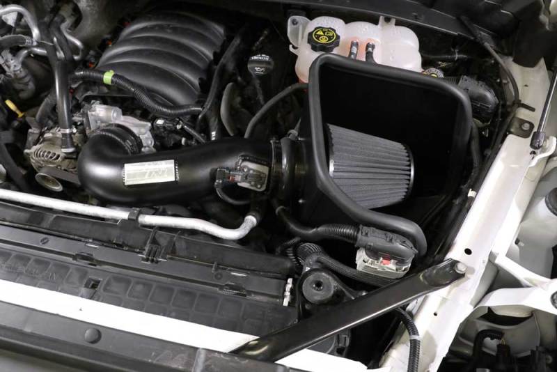 K&N Engineering cold air intake kit installed in a 2019 Chevrolet Silverado 1500 5.3L V8, featuring black performance air filter and intake tube