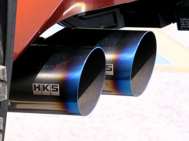 HKS Legamax Trail Master catback exhaust system installed on a 2022 Toyota Tundra, showcasing the sleek exhaust pipes and tips.