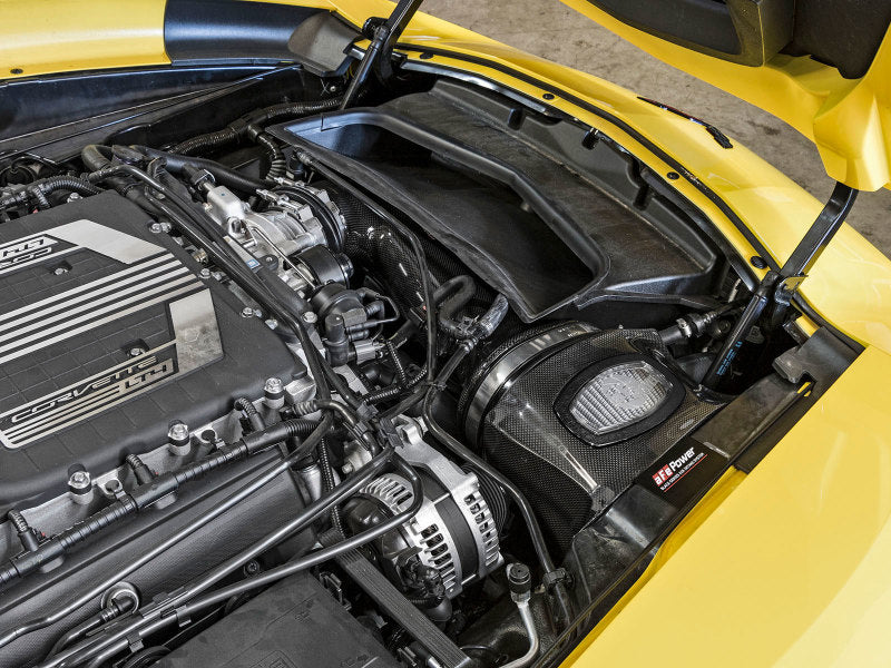 aFe Momentum carbon fiber cold air intake system installed in a 2015-2016 Chevrolet Corvette Z06 V8-6.2L engine bay