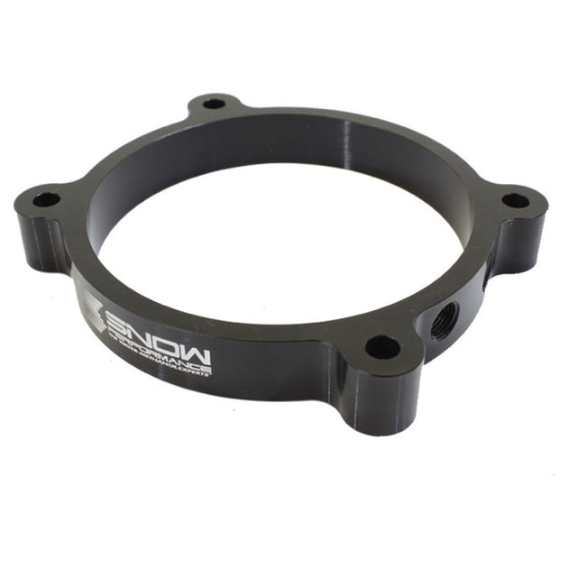 Snow Performance 102mm LS throttle body water meth injection plate showing detailed metal construction and mounting features.