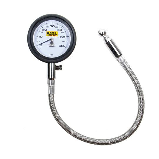 AutoMeter NASCAR performance tire pressure gauge displaying 60 PSI for low-pressure tire measurement with a black and silver dial.