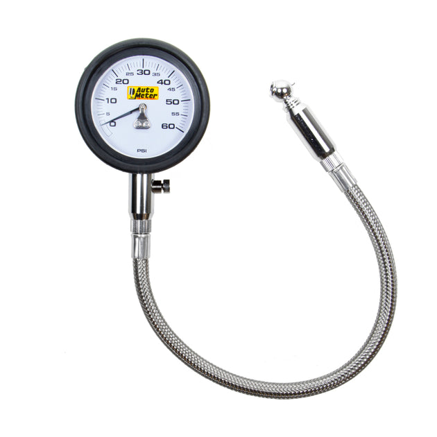 AutoMeter NASCAR performance tire pressure gauge displaying 60 PSI for low-pressure tire measurement with a black and silver dial.