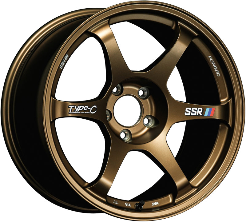 SSR Type-C forged racing bronze wheel, 18x9.5 inches, +38 offset, 5/114.3 bolt pattern, shown from a side angle.